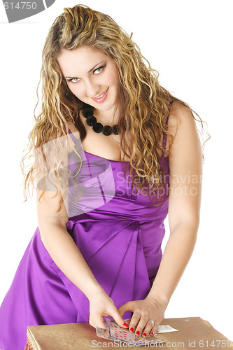 Image of Young curly woman gathering cards