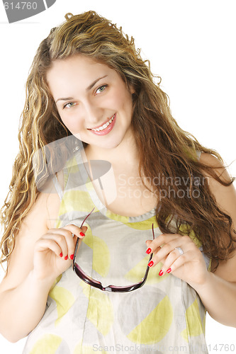 Image of Smiling young woman holding sunglasses