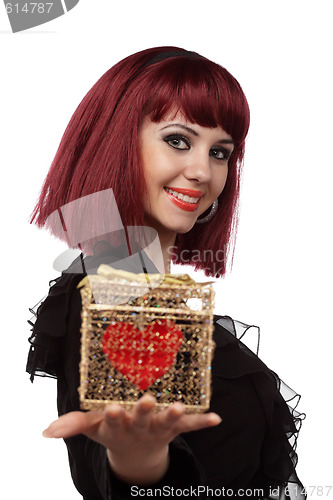 Image of Beautiful woman with heart packed in a golden gift box