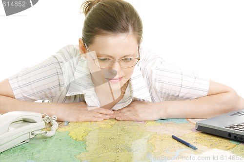 Image of Woman bending over map