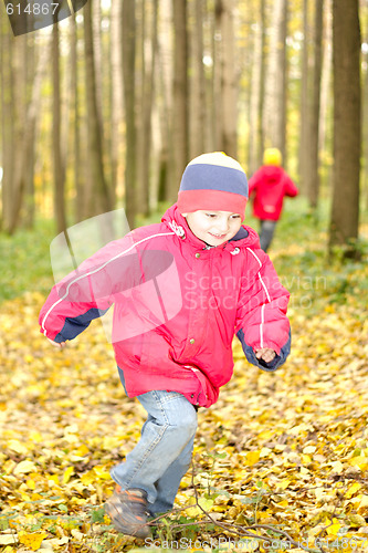 Image of Boy running in forest