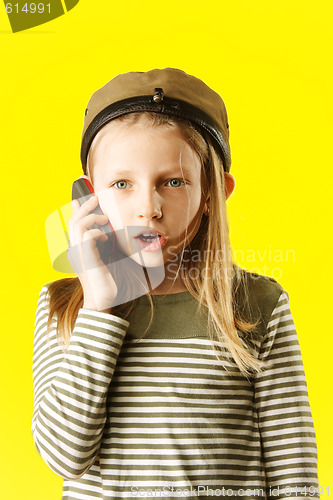 Image of Little girl talking by phone