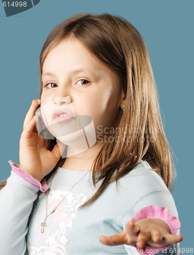 Image of Little girl talking mobile