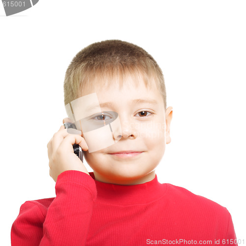 Image of Little boy with phone at ear