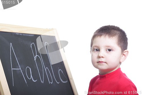 Image of Little boy at blackboard