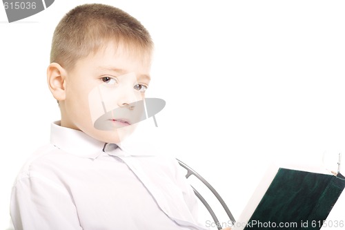 Image of Boy reading book sideview