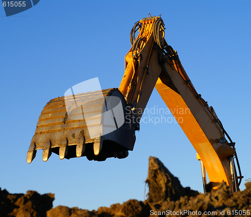 Image of Shovel bucket against blue sky   