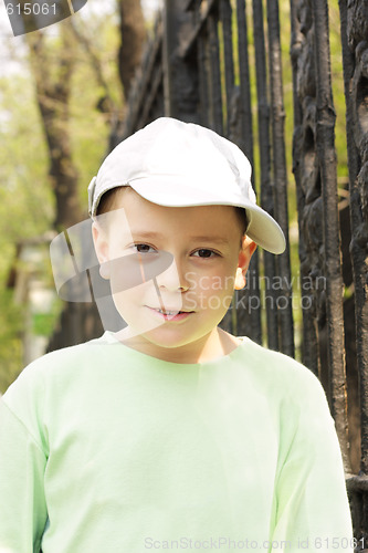 Image of Boy in green outdoors