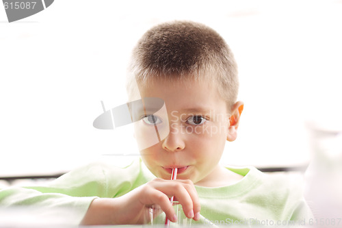 Image of Boy drinking with straw