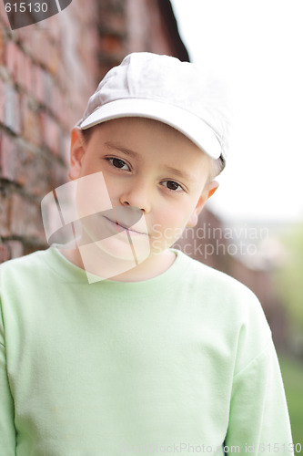 Image of Boy at brick wall