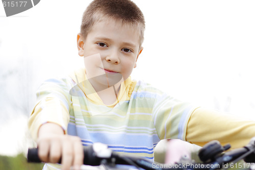 Image of Boy on bike focus on eyes