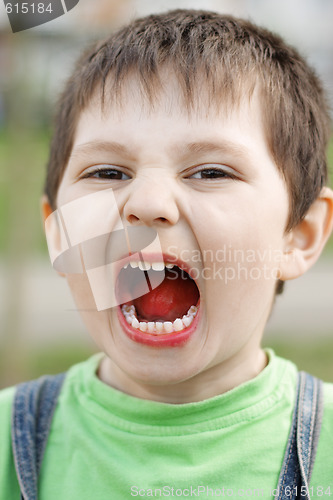 Image of Shouting boy with orange tongue