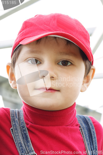 Image of Boy in red cap and shirt