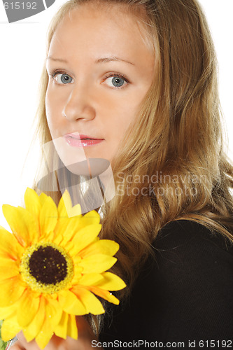 Image of Woman in black with yellow flower