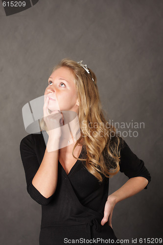 Image of Pensive girl over dark