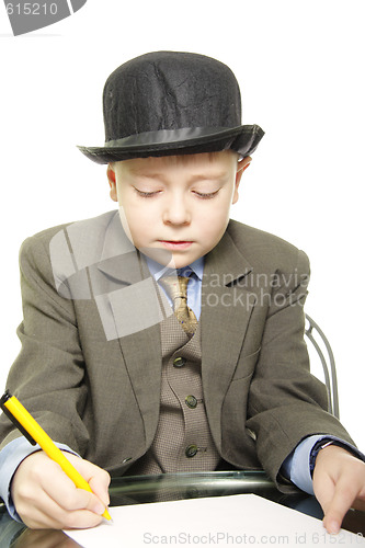 Image of Boy in hat with pen and paper