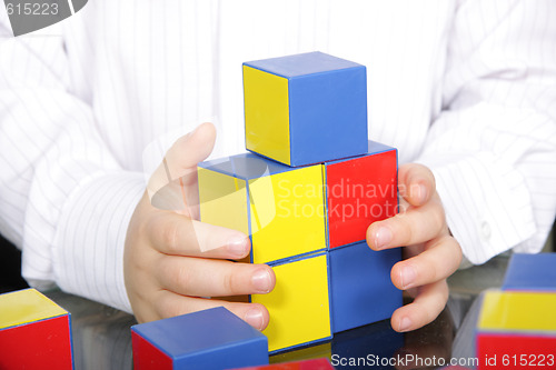 Image of Hands and color bricks