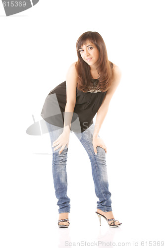 Image of Girl in jeans bending