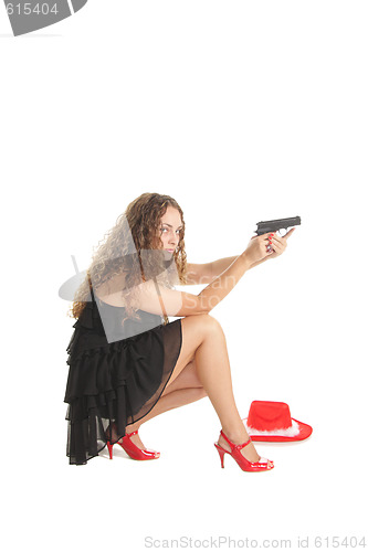 Image of Pretty curled girl with gun