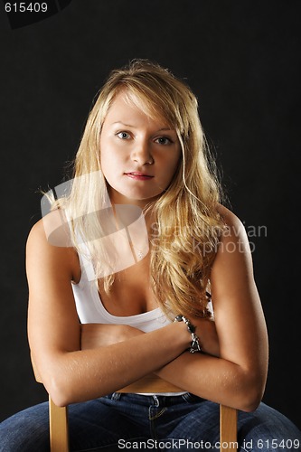 Image of Confident woman on chair