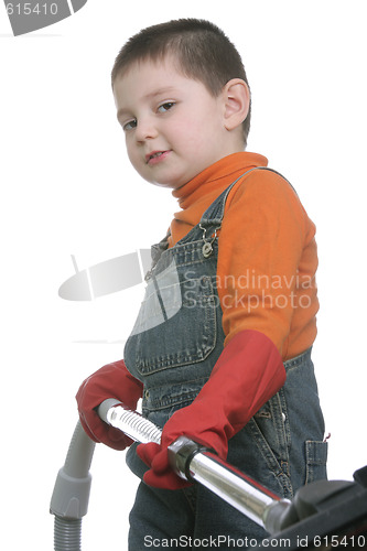 Image of Funny boy with vacuum cleaner hose