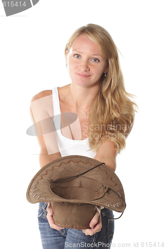 Image of Smiling girl with hat in hand