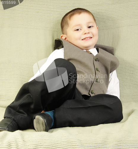 Image of Smiling boy on sofa