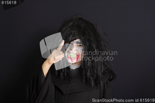 Image of Halloween boy with warning gesture