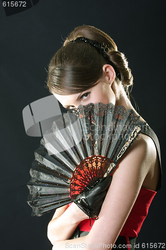 Image of Hiding behind fan