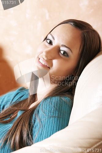Image of Pretty girl in soft chair