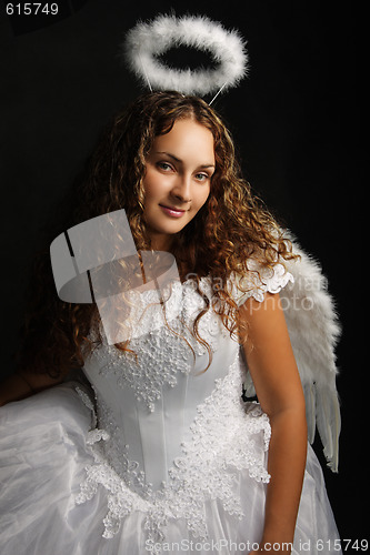 Image of Angel in white against dark