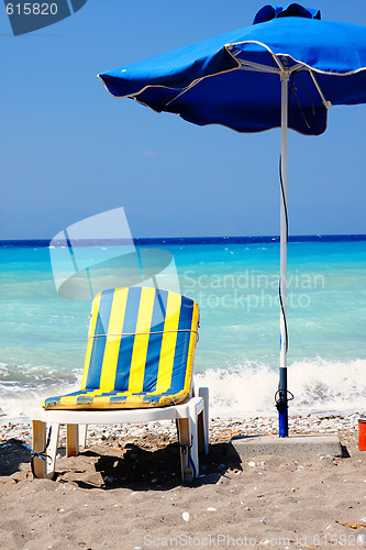 Image of Striped chair under sunshade