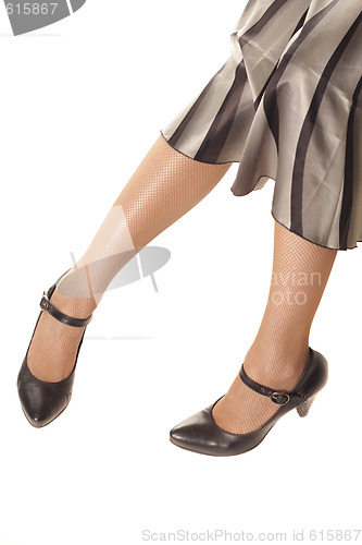 Image of Woman legs in black shoes
