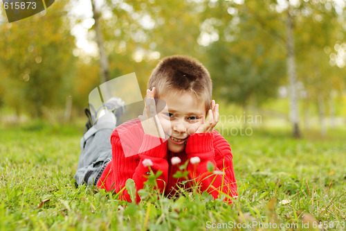 Image of Boy laying on grass