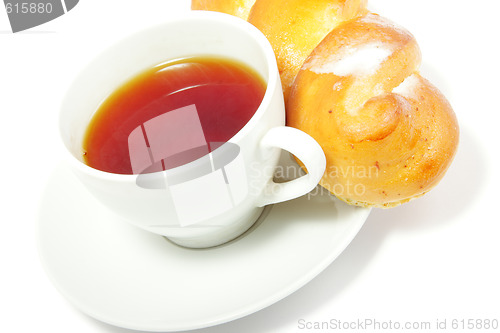 Image of Tea and bun over white