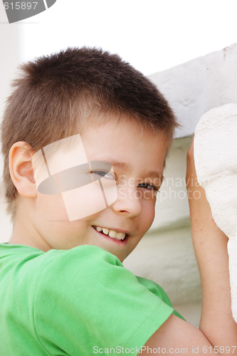 Image of Photo of boy in green