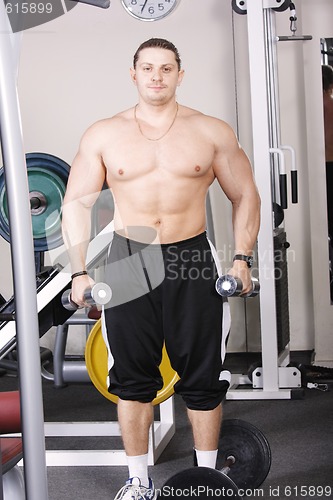 Image of Big guy with dumbbells