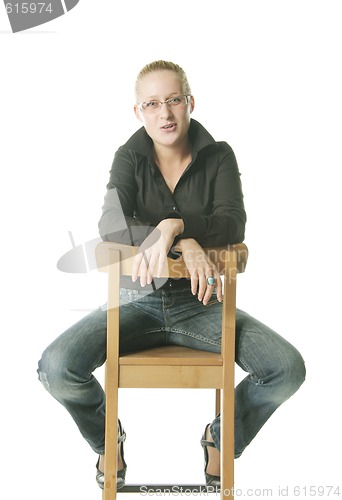 Image of Girl in casual sitting on chair