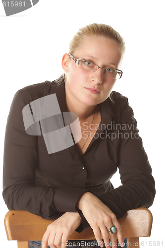 Image of Blonde behind chair