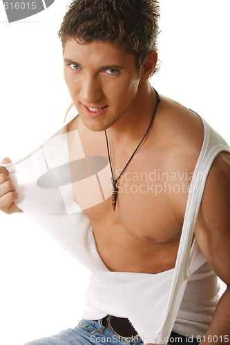 Image of Guy tearing sleeveless shirt