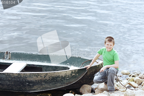 Image of Boy and old boat