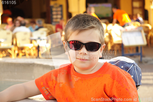 Image of Photo of boy in sunglasses