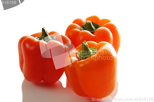 Image of Three orange bellpeppers