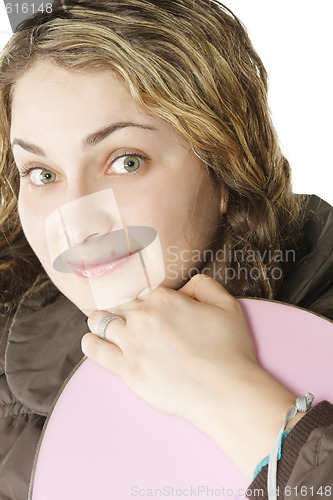 Image of Girl holding snowboard closeup