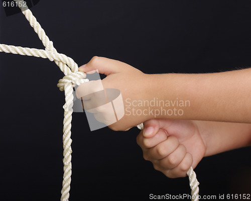 Image of Hands pulling rope