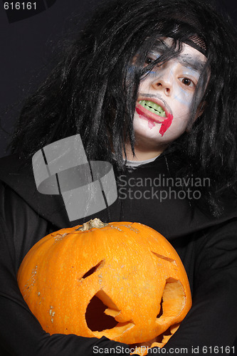 Image of Halloween boy with pumpkin