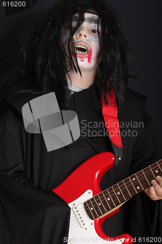 Image of Halloween boy with guitar