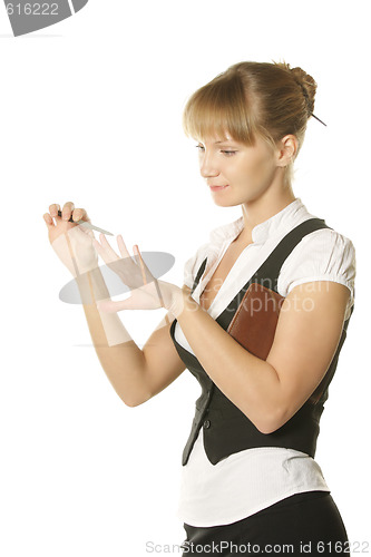 Image of Businesswoman making manicure