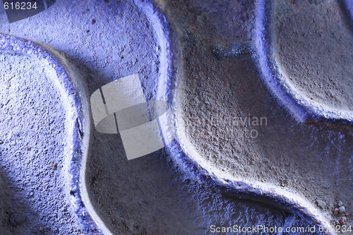 Image of Rusty metal plate in blue light