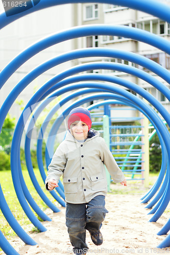 Image of Boy running on playground